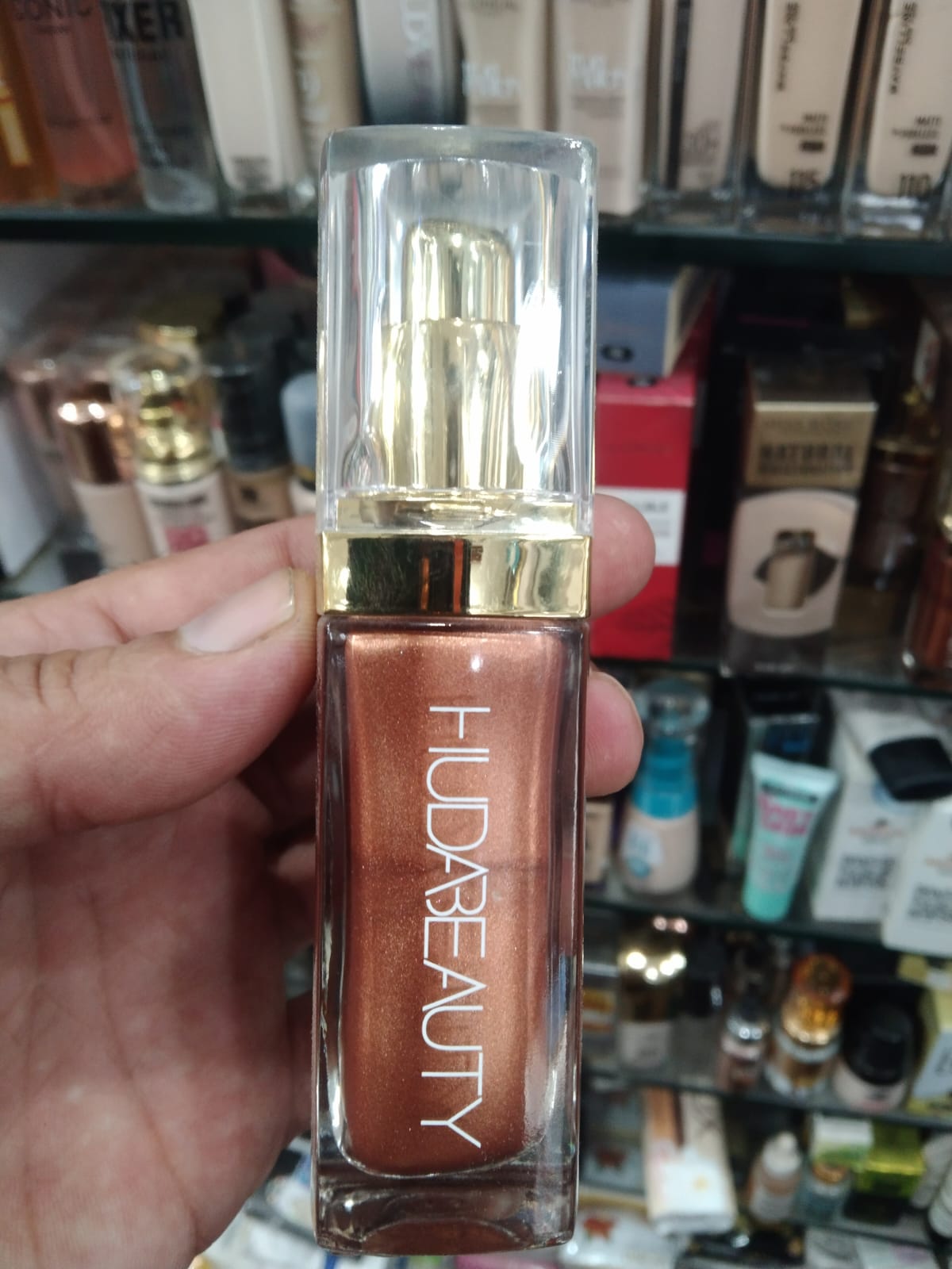 Huda Beauty N.Y.M.P.H. All Over Body Highlighter – Liquid Illuminator for Face, Body &amp; Legs – Water-Based, Long-Lasting Glow – 35 ml